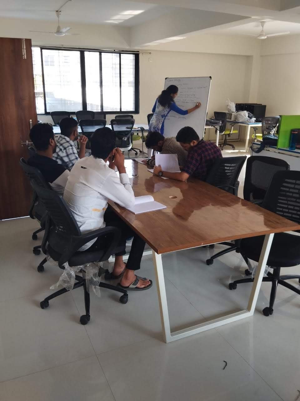 Team session and whiteboard planning at Aadi Technology